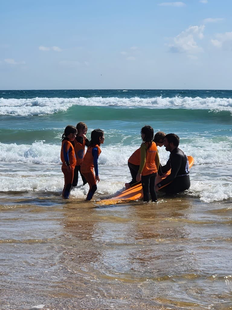 Surf group on the beach with boards